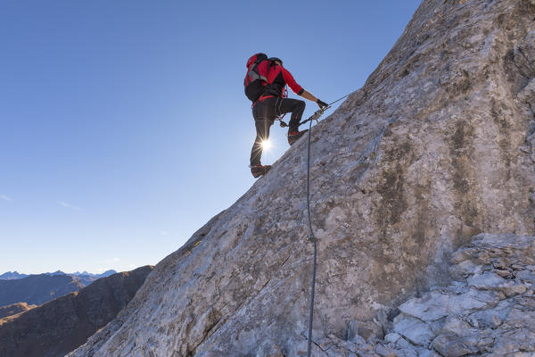 Mountaineer along the via ferrata on the north side of mount Gr. Kinigat, Kartitsch, East Tyrol, Austria, Europe