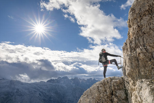 Europe, Italy, Veneto, Agordino, mountain climber on the via ferrata Stella Alpina at mount Agner, Pale di San Martino, Dolomites (MR)