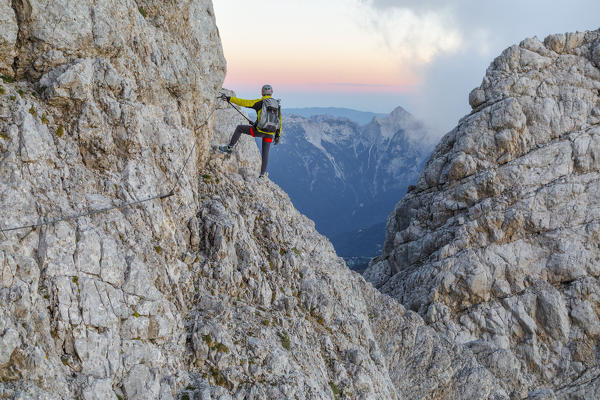 Europe, Italy, Veneto, Agordino, mountain climber on the via ferrata Stella Alpina at mount Agner, Pale di San Martino, Dolomites