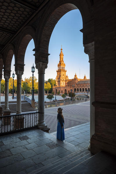 A girl walking in Plaza de Espana, Seville, Andalucia, Spain 