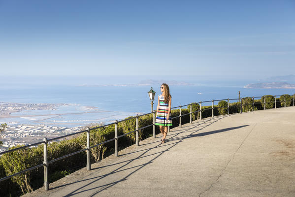 A girl walking in Erice, a small village near Trapani, Western side of Sicily, Italy