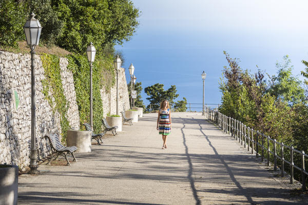 A girl walking in Erice, a small village near Trapani, Western side of Sicily, Italy