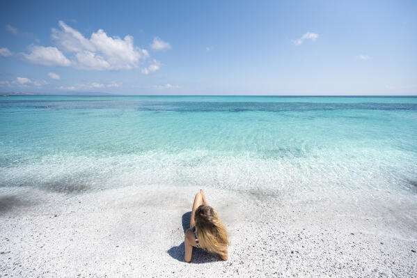 A girl enjoing Stintino La Pelosa beach. Stintino, Sassari province, Sardegna, Italy