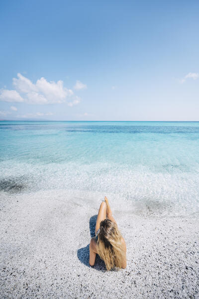 A girl enjoing Stintino La Pelosa beach. Stintino, Sassari province, Sardegna, Italy