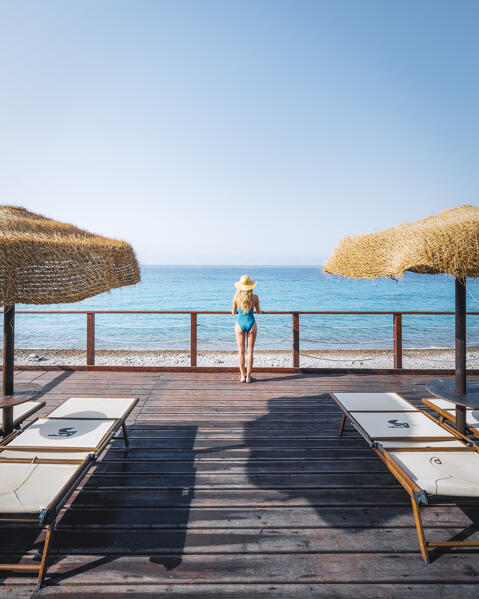 A girl enjoing the sea view near Villasimius, Cagliari Province, Sardegna, Italy