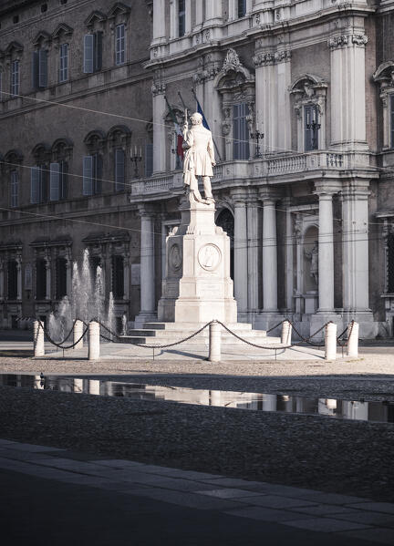 Piazza Roma, iconic square in Modena old town, with .Ciro Menotti statue Modena, Emilia Romagna, Italy