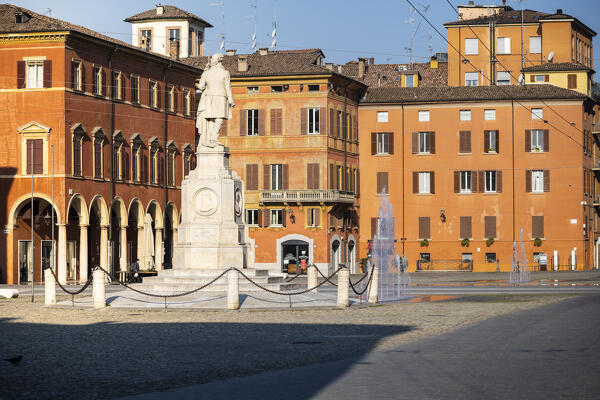 Piazza Roma, iconic square in Modena old town, with .Ciro Menotti statue Modena, Emilia Romagna, Italy