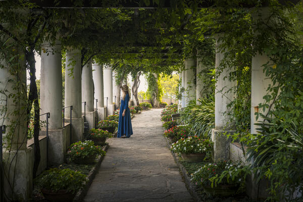 A girl walking in Villa Lysis garden, Capri island, Campania, Italy