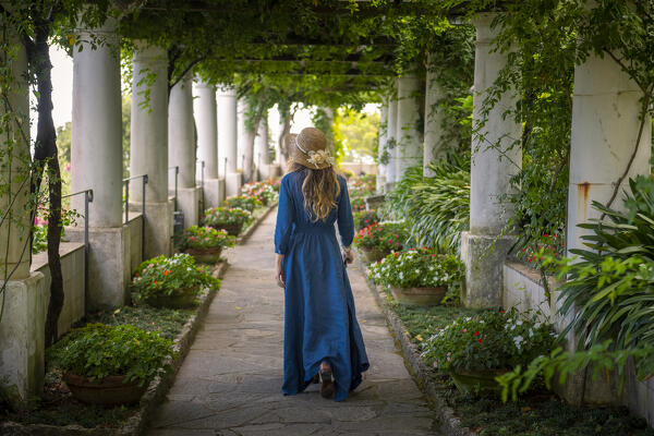A girl walking in Villa San Michele garden, Capri island, Campania, Italy