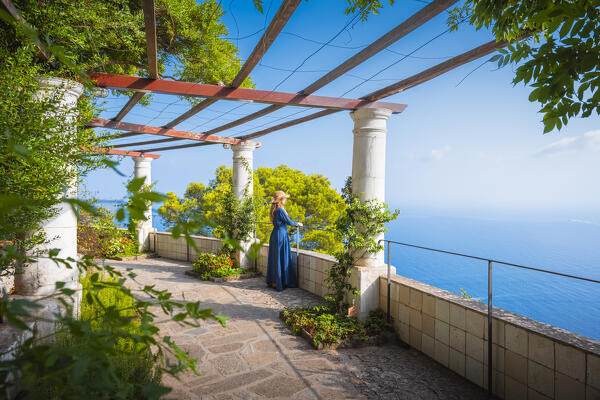 A girl walking in Villa San Michele garden, Capri island, Campania, Italy