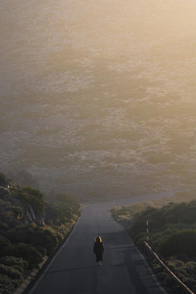 Woman walking in Teide National park. Tenerife, Canary Islands, Spain