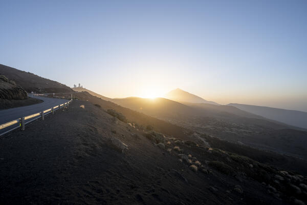 Sunset in Teide natural park with Teide observatory and Teide volcano. Tenerife, Canary islands, Spain.