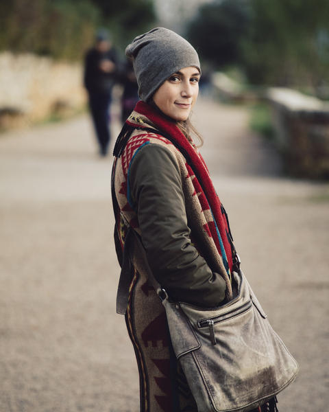 Portrait of a girl walking in Pienza, Siena province, Tuscany, Italy