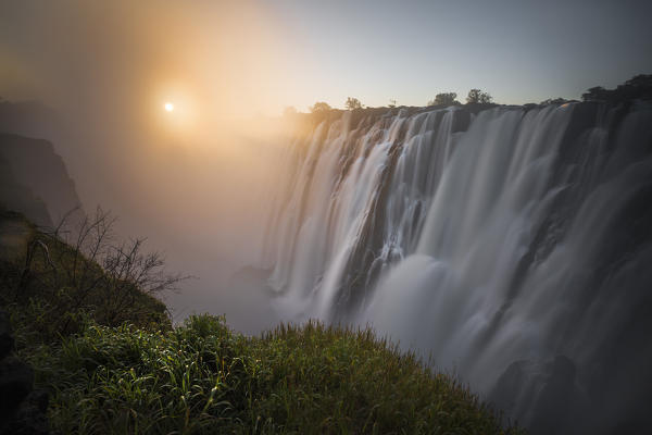 Victoria falls at sunset, depicted from Zambian side. Zimbabwe, Africa