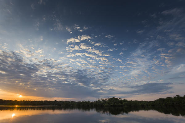 The rio negro waters depicted at sunrise, with stunning sky.
Rio Negro; Amazonas; Amazonia; Manaus; Brazil, South America.