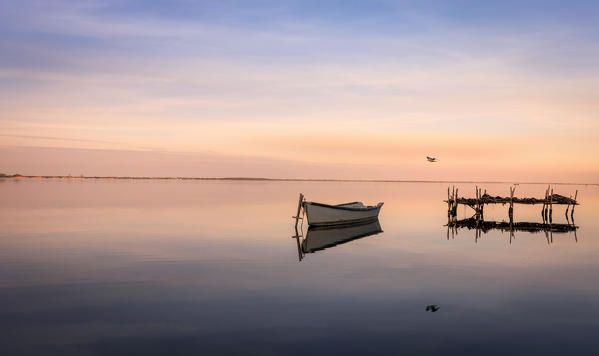 Lesina lake at sunset, Lesina village, Foggia district, Apulia, Italy