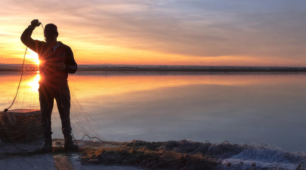 Lesina lake at sunset, Lesina village, Foggia district, Apulia, Italy