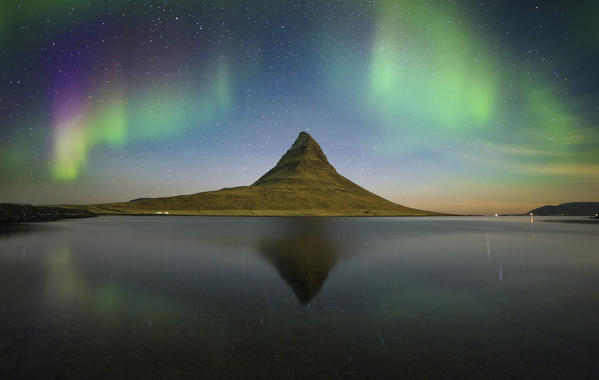 Aurora Borealis in Kirkjufell mountain , Grundarfjordur village, Iceland.