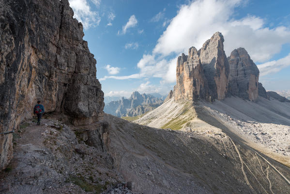 foto  - Europe, Italy, Dolomites, Veneto, Belluno. Hiker admire Tre Cime di Lavaredo from Trenches of the First World War on Mount Paterno