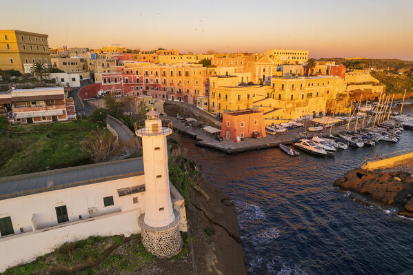 foto  - Aerial view of the colourful sea village of Ventotene with the lighthouse and the old roman harbour at sunrise, Ventotene Islands, Pontine Islands Archipelago, Tyrrhenian Sea, Latina province, Latium, Italy, Europe